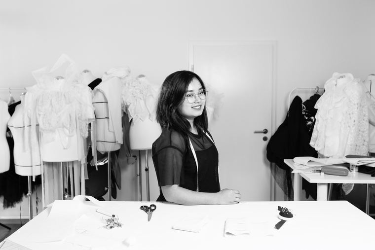 Sherrmae in the atelier between dress forms