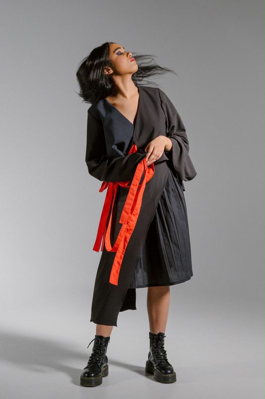 Black wrap coat tied with red ribbons