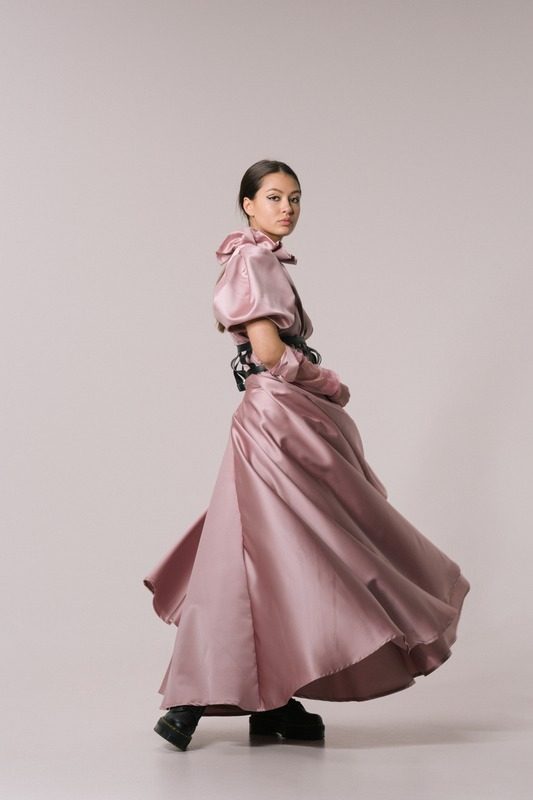 Pink satin gown in motion
